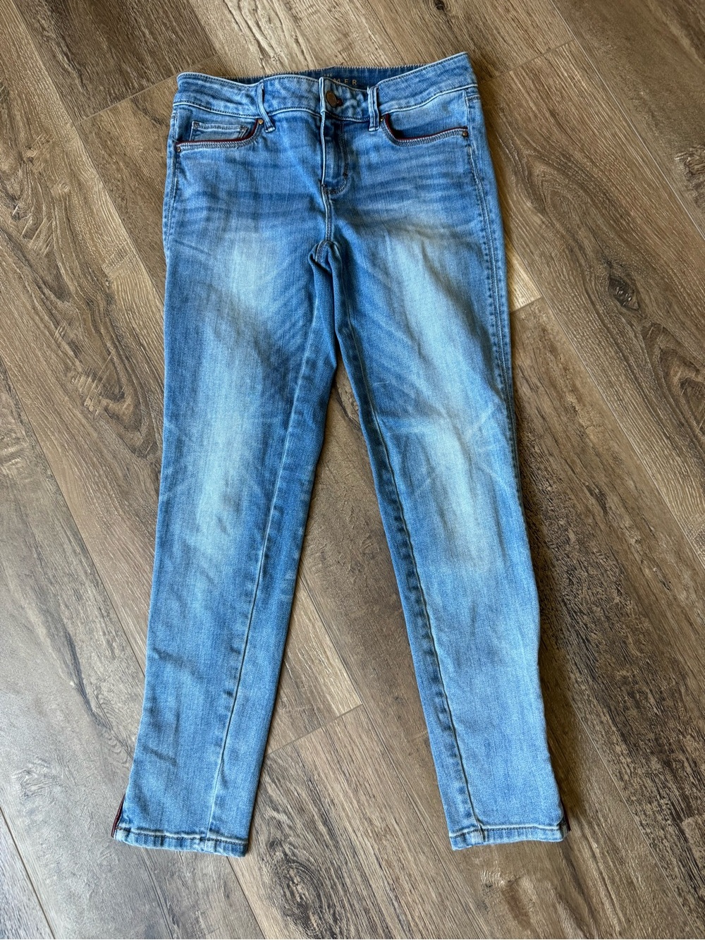 White House Black Market Faded Light Blue Skinny Jeans with Red Leather Details
